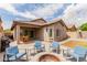 Inviting backyard patio with comfortable seating around a fire pit, perfect for outdoor relaxation and entertainment at 10738 W Rowel Rd, Peoria, AZ 85383