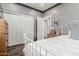 Bedroom showcases hardwood floors, a double-door closet, and neutral-colored walls at 10738 W Rowel Rd, Peoria, AZ 85383