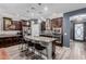 Spacious kitchen with large island, granite countertops, stainless appliances, and dark wood cabinetry at 10738 W Rowel Rd, Peoria, AZ 85383