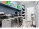 Laundry room with newer machines and lots of shelving space for storage and organization at 10738 W Rowel Rd, Peoria, AZ 85383