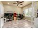Bright office space features multiple computer setups, tiled floors, and natural light at 10738 W Rowel Rd, Peoria, AZ 85383