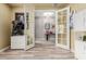 View of an office with tiled floors and natural light filtering through French doors at 10738 W Rowel Rd, Peoria, AZ 85383