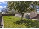 Well-maintained backyard with green grass and desert landscaping at 10923 E Flower Ave, Mesa, AZ 85208