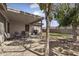 Backyard featuring a covered patio, grill, and ample seating at 10923 E Flower Ave, Mesa, AZ 85208
