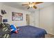 Comfortable bedroom featuring a ceiling fan, carpet floors, and a closet at 10923 E Flower Ave, Mesa, AZ 85208