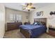 Cozy bedroom showcases carpet floors and a ceiling fan at 10923 E Flower Ave, Mesa, AZ 85208