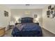 Comfortable bedroom features a plush bed, stylish decor, and ambient lighting at 10923 E Flower Ave, Mesa, AZ 85208