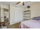 Bedroom featuring a window and closet, plus a ceiling fan for added comfort at 10923 E Flower Ave, Mesa, AZ 85208