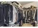 Walk-in closet with organized hanging racks and shelving at 10923 E Flower Ave, Mesa, AZ 85208