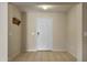 Welcoming entryway with neutral walls and tile flooring, leading to other parts of the home at 10923 E Flower Ave, Mesa, AZ 85208