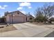 Charming single-story home with a well-maintained front yard and a two-car garage at 10923 E Flower Ave, Mesa, AZ 85208