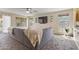 Spacious living room with a comfortable sectional sofa and plenty of natural light from windows at 10923 E Flower Ave, Mesa, AZ 85208