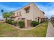 Charming two-story home featuring well-maintained landscaping and a red tile roof at 1208 E Lawrence Ln, Phoenix, AZ 85020