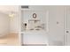Bright kitchen featuring white cabinetry and pass-through to adjacent space at 1208 E Lawrence Ln, Phoenix, AZ 85020
