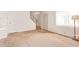 Spacious living room with a view of the staircase and a large window at 1208 E Lawrence Ln, Phoenix, AZ 85020