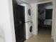 Convenient stacked washer and dryer near a cabinet at 12221 W Bell Rd # 209, Surprise, AZ 85378