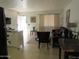 Comfortable living room featuring tile floors, neutral paint, and natural light at 12221 W Bell Rd # 209, Surprise, AZ 85378