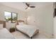 Bright bedroom featuring a ceiling fan and a window that allows for ample natural light at 12821 N 67Th St, Scottsdale, AZ 85254