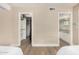 Bedroom view highlighting access to a closet and en-suite bathroom, with neutral wall color at 12821 N 67Th St, Scottsdale, AZ 85254