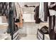 Walk-in closet with built-in shelving, drawer storage, and ample space for organization at 12821 N 67Th St, Scottsdale, AZ 85254