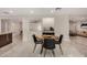 Bright dining area with modern black chairs and beautiful marble floors at 12821 N 67Th St, Scottsdale, AZ 85254