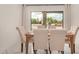 Formal dining room features large windows and views of the beautiful desert landscaping at 12821 N 67Th St, Scottsdale, AZ 85254