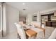 Elegant dining room with seating for six and views of the kitchen at 12821 N 67Th St, Scottsdale, AZ 85254