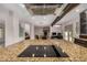 Contemporary kitchen features a large center island with cooktop and stainless steel hood at 12821 N 67Th St, Scottsdale, AZ 85254