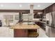 Updated kitchen with granite counters, stainless appliances, and large center island at 12821 N 67Th St, Scottsdale, AZ 85254