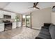 Open-concept living area with modern finishes, opening to the backyard through sliding glass doors at 12821 N 67Th St, Scottsdale, AZ 85254