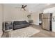 Cozy living room with a comfortable sofa, wine fridge, and a view into the kitchen at 12821 N 67Th St, Scottsdale, AZ 85254