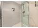 Bright shower with gray tiling, built-in niche, and glass door, perfect for a modern and clean look at 12821 N 67Th St, Scottsdale, AZ 85254