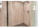 Stylish shower with neutral-toned tile walls, glass enclosure, and a modern shower head at 12821 N 67Th St, Scottsdale, AZ 85254
