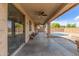Back patio featuring a ceiling fan, and view to the swimming pool with seating at 13304 W Stella Ln, Litchfield Park, AZ 85340