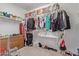 Walk in closet with ample storage space for clothing and accessories at 13304 W Stella Ln, Litchfield Park, AZ 85340