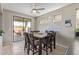Cozy dining room with access to the outdoor patio, perfect for Gathering meals at 13304 W Stella Ln, Litchfield Park, AZ 85340