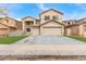 Charming two-story home featuring a 2-car garage, low maintenance landscaping, and neutral color palette at 13304 W Stella Ln, Litchfield Park, AZ 85340
