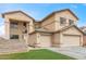 Charming two-story home featuring a 2-car garage, low maintenance landscaping, and neutral color palette at 13304 W Stella Ln, Litchfield Park, AZ 85340