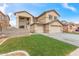 Charming two-story home featuring a 2-car garage, low maintenance landscaping, and neutral color palette at 13304 W Stella Ln, Litchfield Park, AZ 85340
