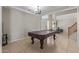 Bright game room featuring a pool table, offering a versatile space for entertainment at 13304 W Stella Ln, Litchfield Park, AZ 85340