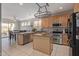 Well-equipped kitchen featuring stainless steel appliances and an eat-in dining area at 13304 W Stella Ln, Litchfield Park, AZ 85340