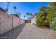 Private backyard with a desert landscape, block wall and beautiful flowering shrubs at 1334 W Sells Dr, Phoenix, AZ 85013