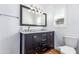 Bathroom featuring a double sink vanity with a dark wood finish and marble countertops at 1334 W Sells Dr, Phoenix, AZ 85013