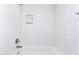 Clean bathroom bathtub and shower with white subway tiles and a recessed shelf at 1334 W Sells Dr, Phoenix, AZ 85013