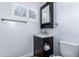 Bathroom featuring a single sink vanity with a dark wood finish at 1334 W Sells Dr, Phoenix, AZ 85013