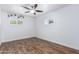 Bright bedroom featuring stylish faux-wood floors, plantation shutters and unique monkey decals at 1334 W Sells Dr, Phoenix, AZ 85013