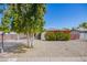Charming single-story home featuring low maintenance gravel landscaping and a mature shade tree at 1334 W Sells Dr, Phoenix, AZ 85013