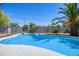 Inviting swimming pool with sparkling water, a diving board and a safety fence at 1334 W Sells Dr, Phoenix, AZ 85013