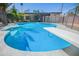 Backyard pool with diving board, basketball hoop, and safety fence at 1334 W Sells Dr, Phoenix, AZ 85013