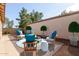 Virtually staged backyard features outdoor seating at 13521 E Butler St, Chandler, AZ 85225